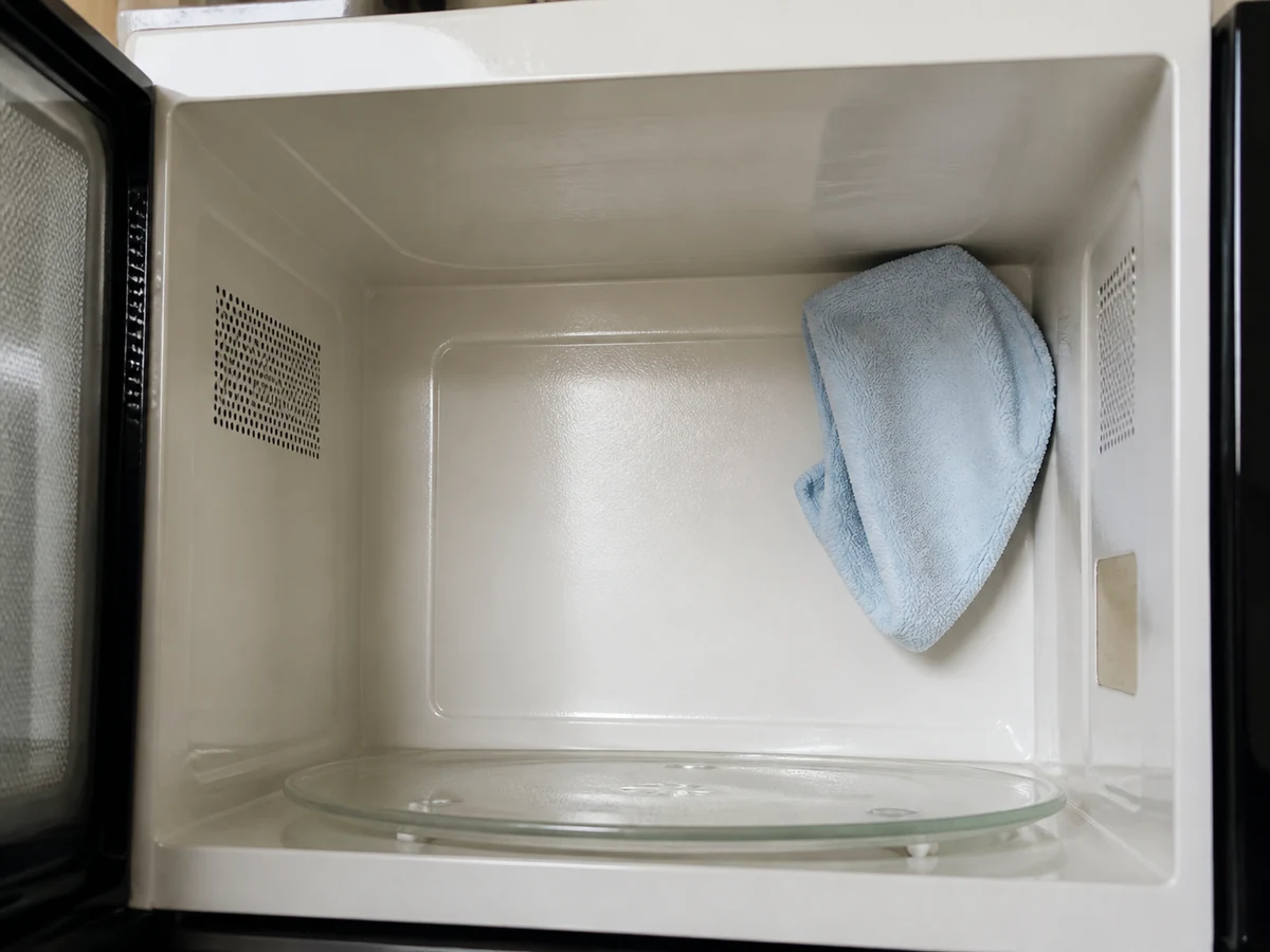 How to Clean the Inside of a Microwave: Wipe the cavity and ceiling