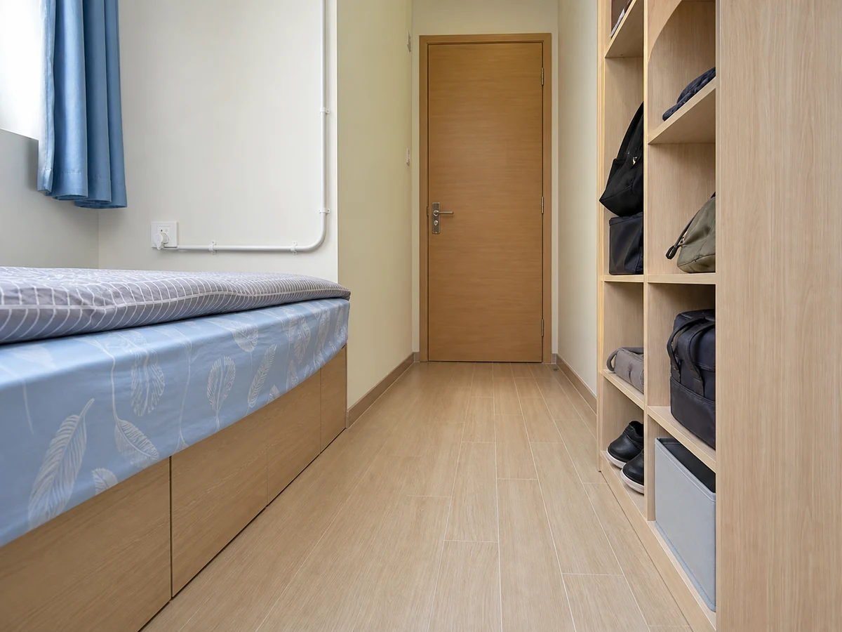 Leaving shoes and baskets beside the bed route — Move them into stable storage and clear the full route.