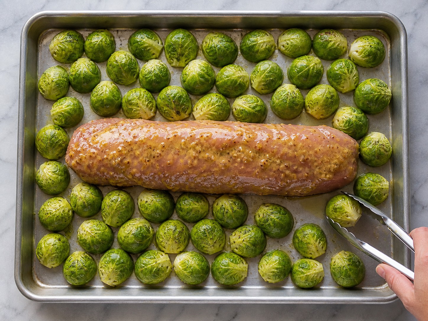American Maple-Mustard Pork Tenderloin with Brussels Sprouts — Arrange pork and sprouts on the tray