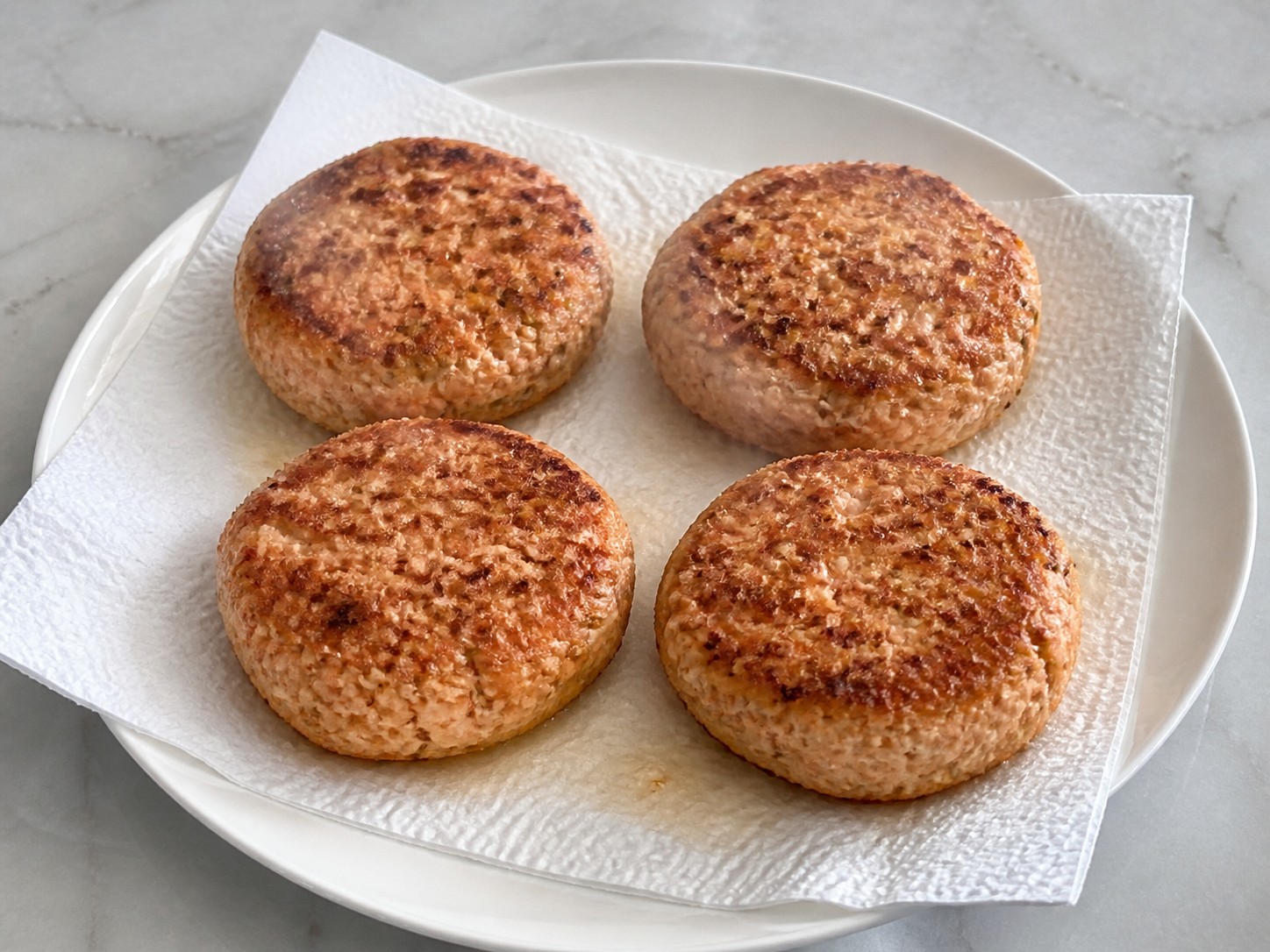 American Salmon Burgers with Cucumber Dill Sauce — Rest the patties for two minutes