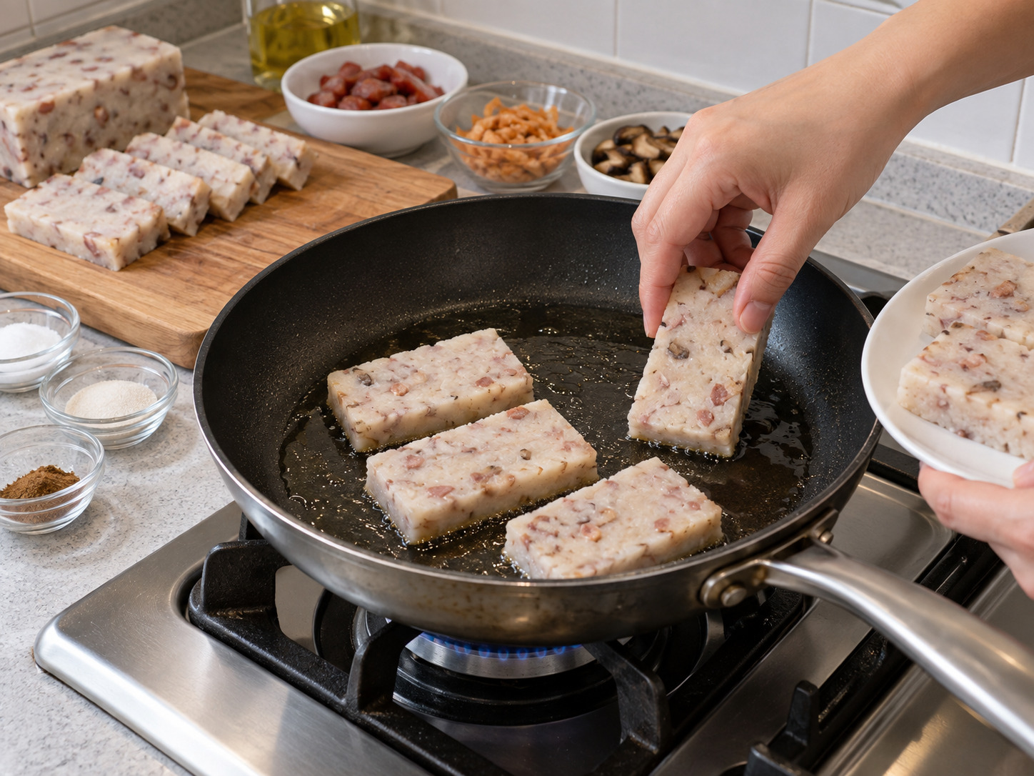 Cantonese Pan-Fried Taro Cake — Heat the remaining oil in the frying pan and add the taro-cake slices