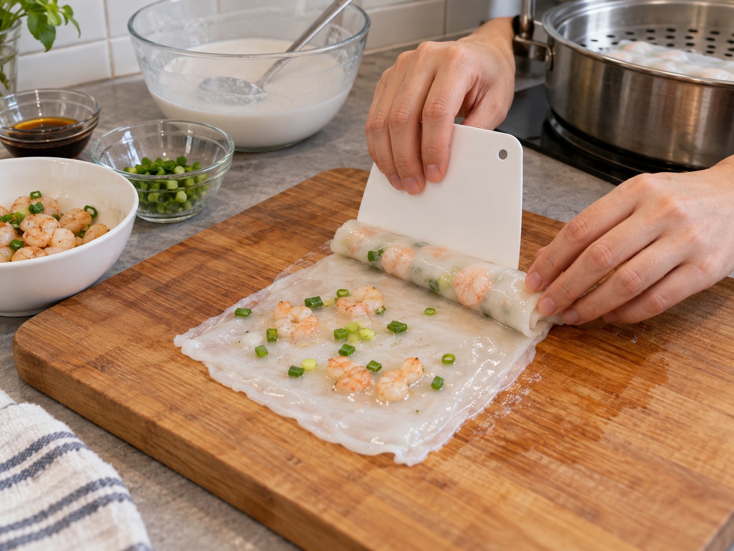 Cantonese Shrimp Rice Noodle Rolls — Use a scraper to roll the sheet around the shrimp