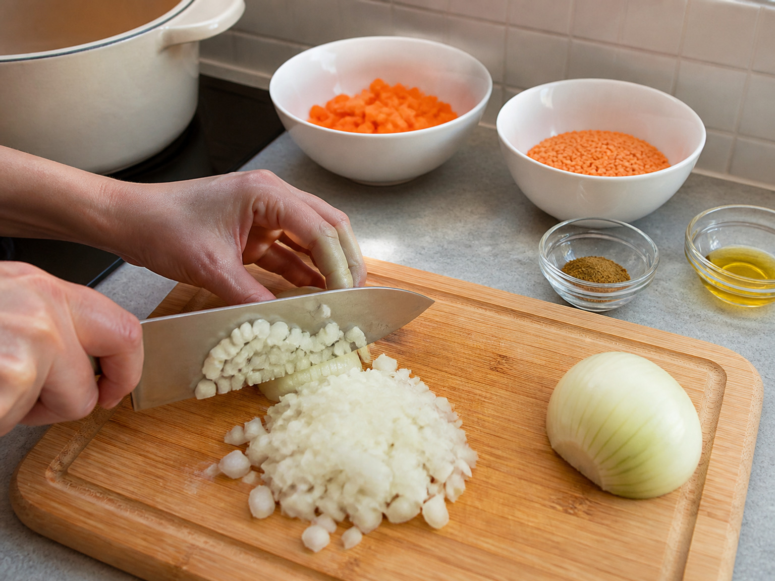 Dice the onion: Peel the whole onion and cut it into even 1 cm dice for steady softening.