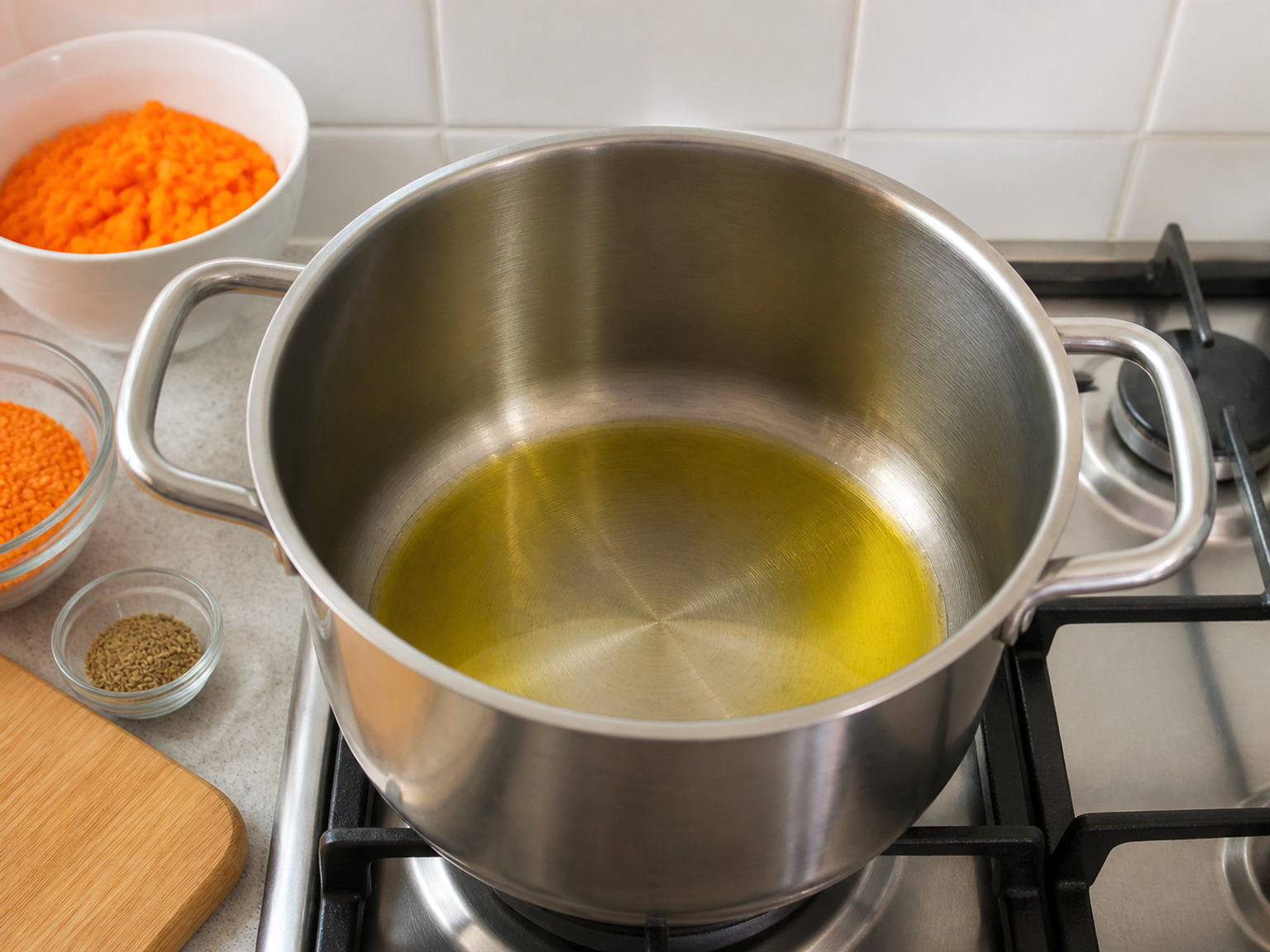 Warm the olive oil: Heat all 2 tablespoons olive oil in a soup pot over medium heat until fluid and shimmering but not smoking.