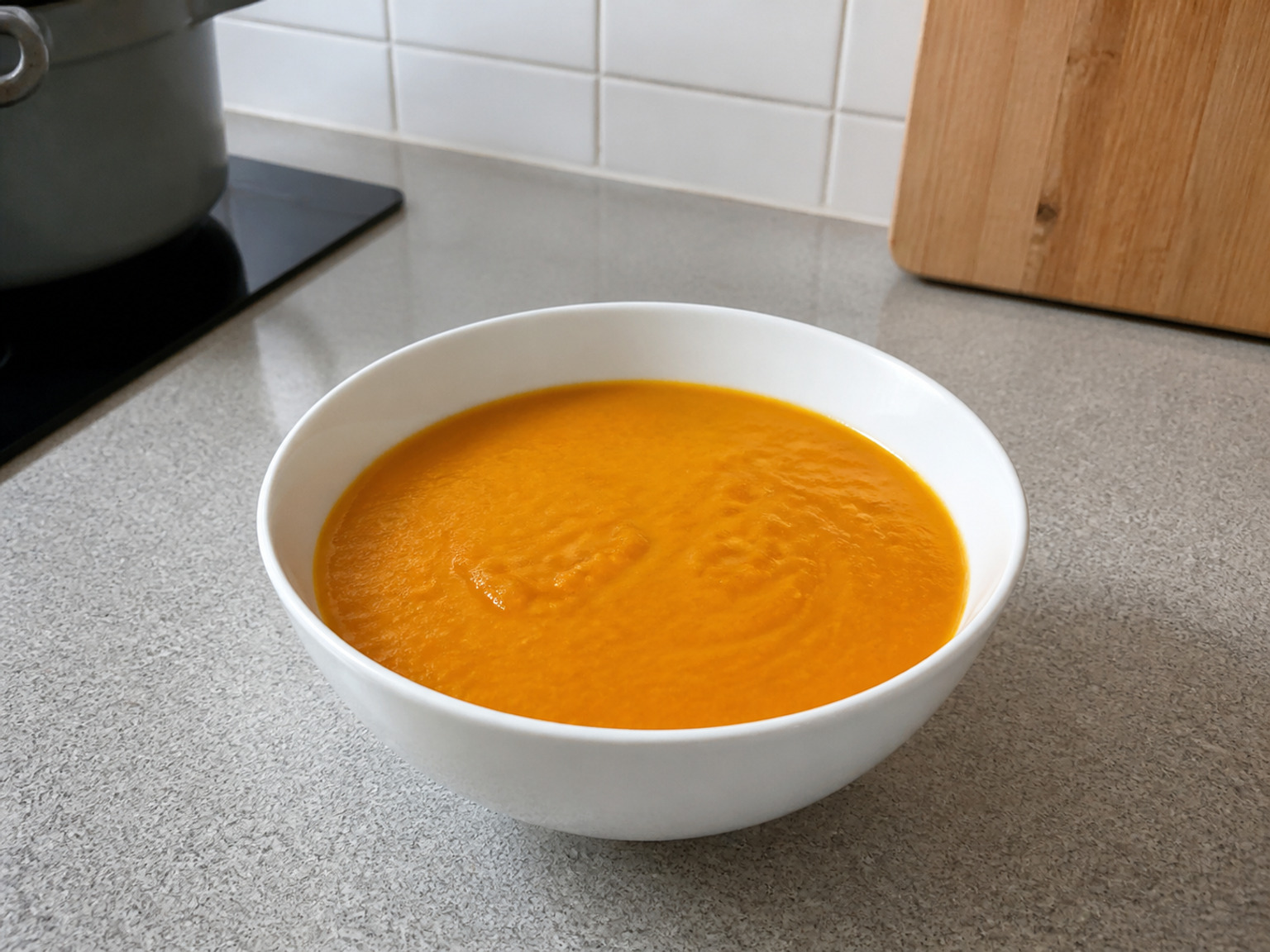 Reheat and adjust the consistency: Reheat over low heat for 5 minutes, stirring, until piping hot; add hot water 50 ml at a time only if too thick, then divide into 6 bowls.