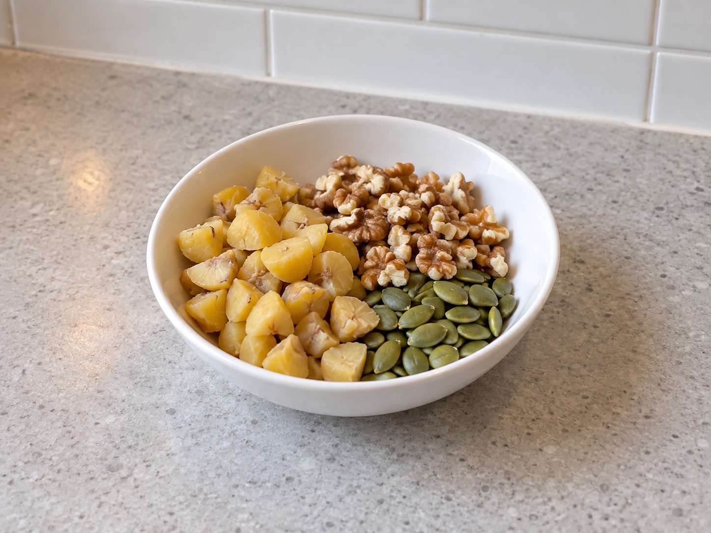 Eight Treasure Sweet Glutinous Rice — Break chestnuts and walnuts into small pieces and set aside with pumpkin seeds