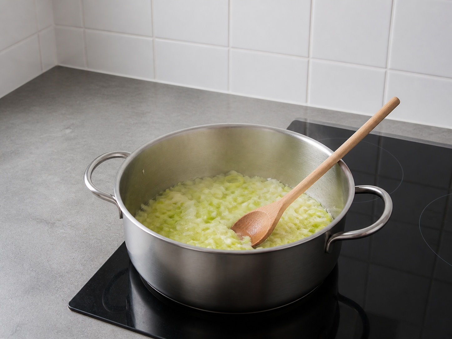 Soften onion and leek in butter: Soften onion and leek in butter. Use the listed ingredients and the appropriate household tool in order; confirm the food has reached the described state before continuing.