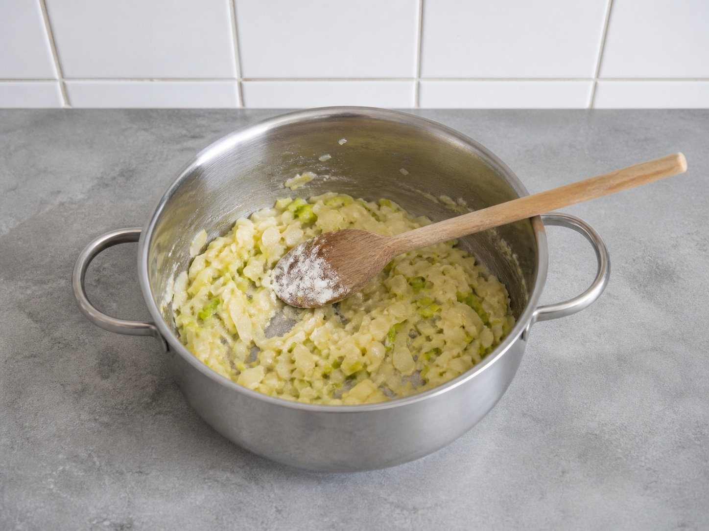 Stir in flour: Stir in flour. Use the listed ingredients and the appropriate household tool in order; confirm the food has reached the described state before continuing.