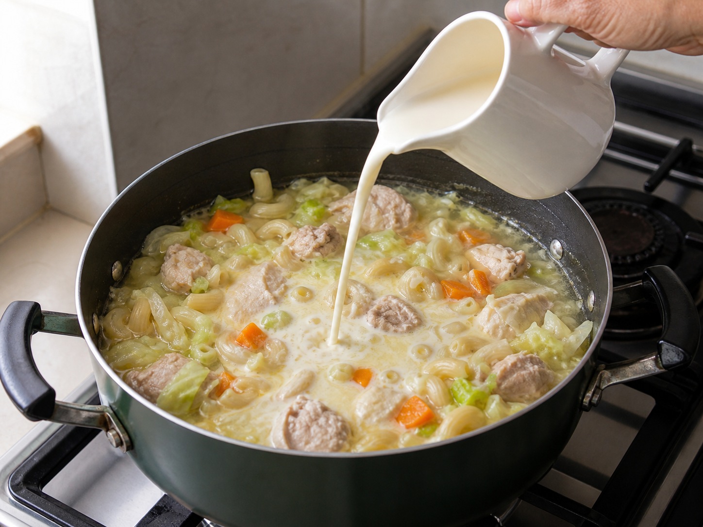 Filipino Chicken Sopas: Add evaporated milk