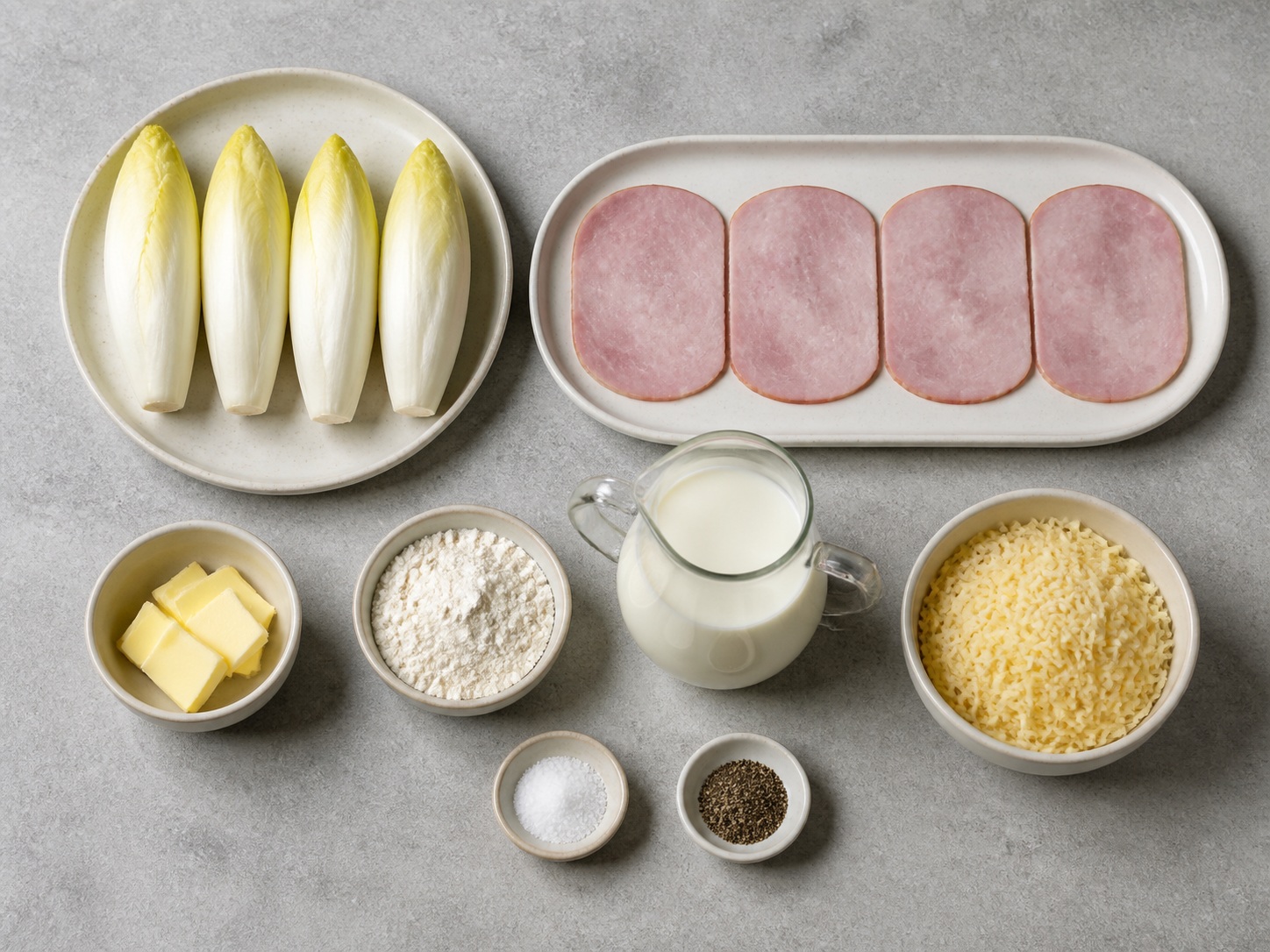 Gratin Endive dan Ham Prancis: 4 buah endive Belgia, 8 buah ham matang, 40 g mentega, 40 g tepung terigu serbaguna, 500 ml susu, 100 g keju Gruyere, 1 sdt garam, 1 sdt Lada hitam