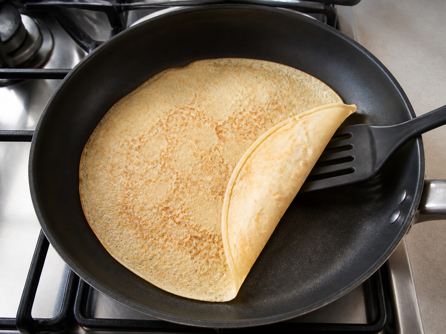 French Mushroom and Leek Crêpes — Cook and turn the crêpe: Cook the first side 1 minute, turn when the edge dries, then cook 30 seconds.