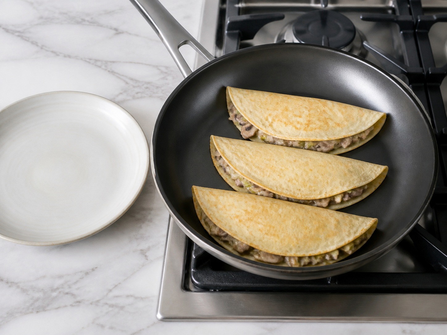 French Mushroom and Leek Crêpes — Warm and serve: Warm the folded crêpes seam-side down for 1 minute and serve intact.