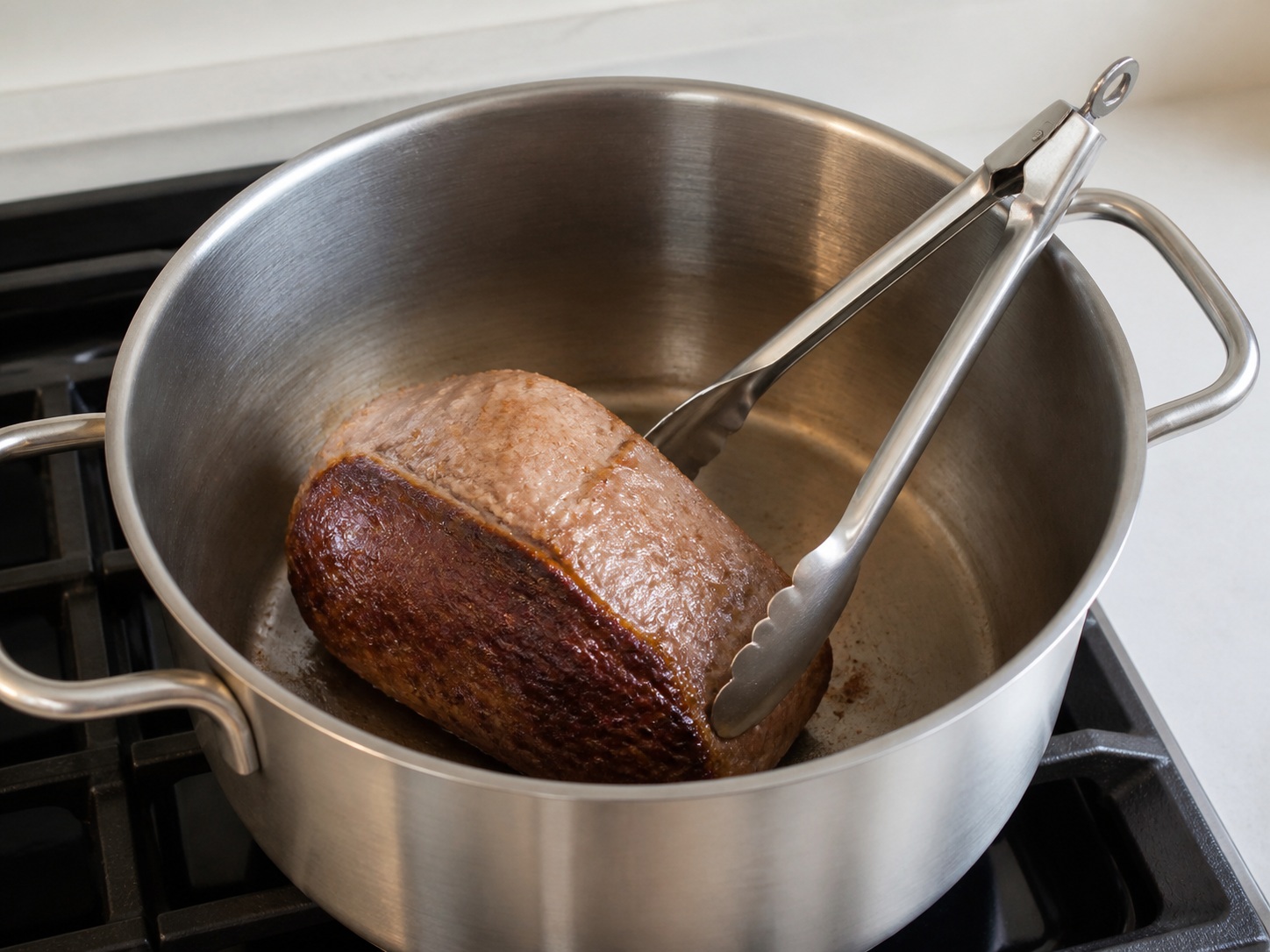Brown the beef roast: Brown the beef roast. Use the listed ingredients and the appropriate household tool in order; confirm the food has reached the described state before continuing.