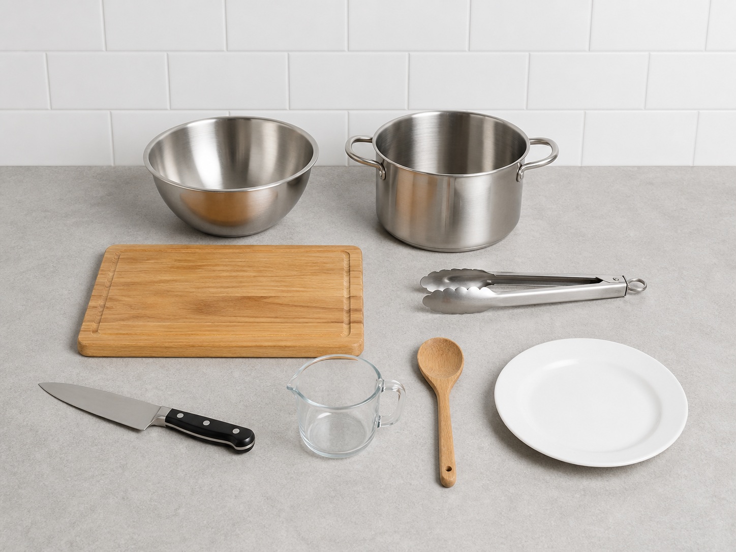 German Sauerbraten with Red Cabbage: knife, cutting board, mixing bowl, stockpot, tongs, measuring cup, wooden spoon, serving plate