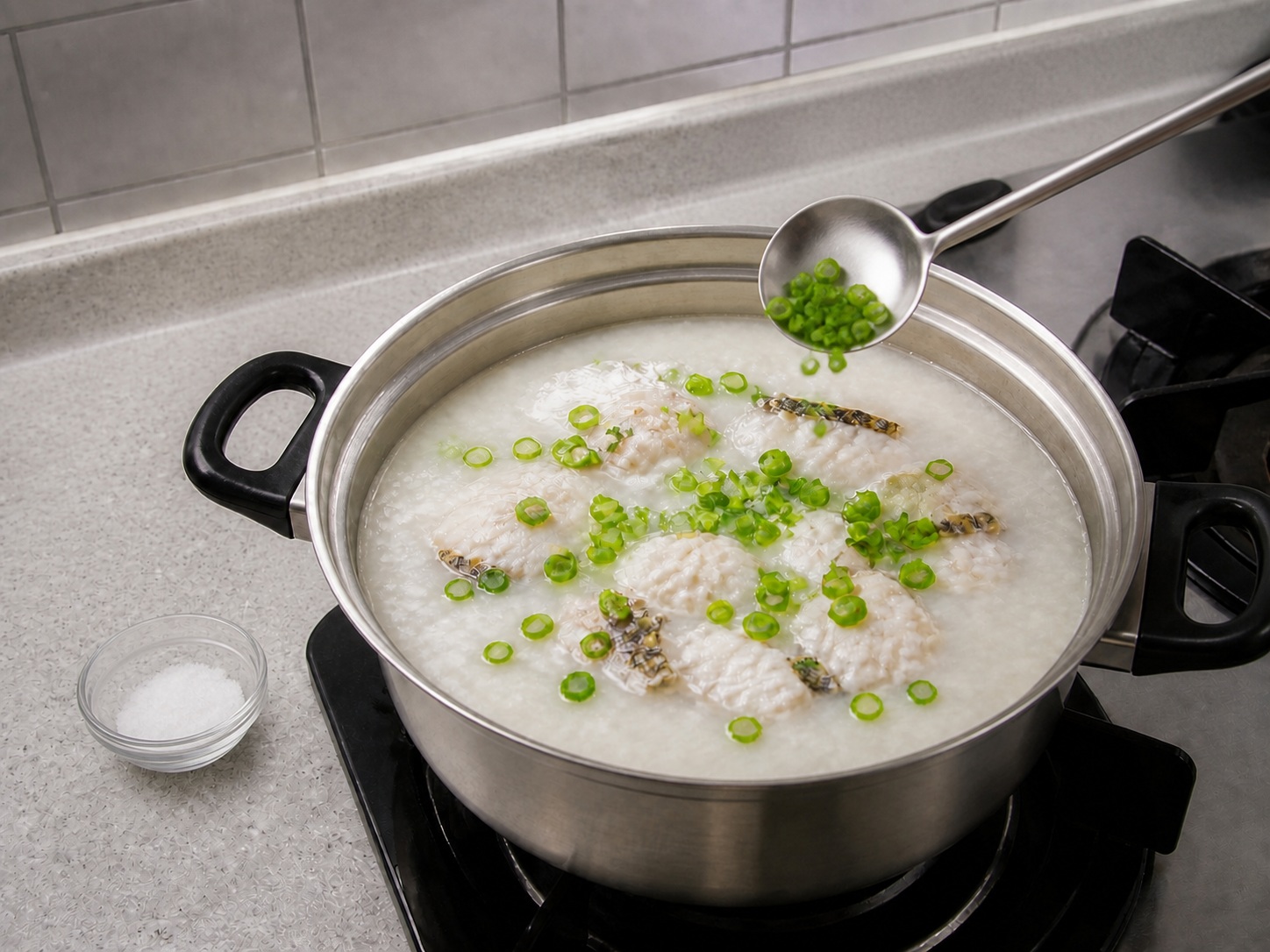 Ginger Fish Fillet Congee — step 11: Season and add spring onion
