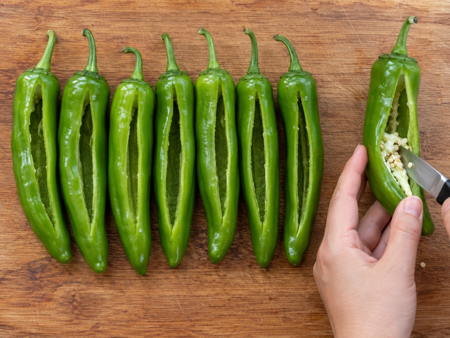 Guangxi Stuffed Tofu Peppers — 5. Cut a lengthwise opening in each green pepper and remove seeds without splitting it