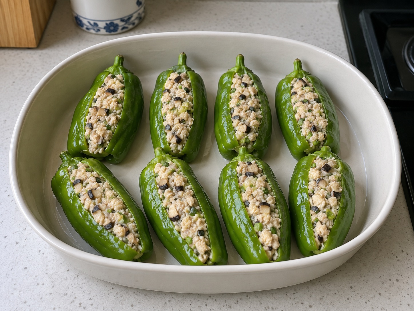 Guangxi Stuffed Tofu Peppers — 8. Set peppers in a shallow heatproof dish with openings facing up
