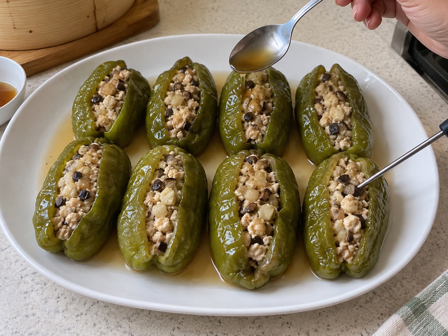 Guangxi Stuffed Tofu Peppers — 12. Check peppers are tender and filling reaches 75°C; spoon thin sauce over and serve