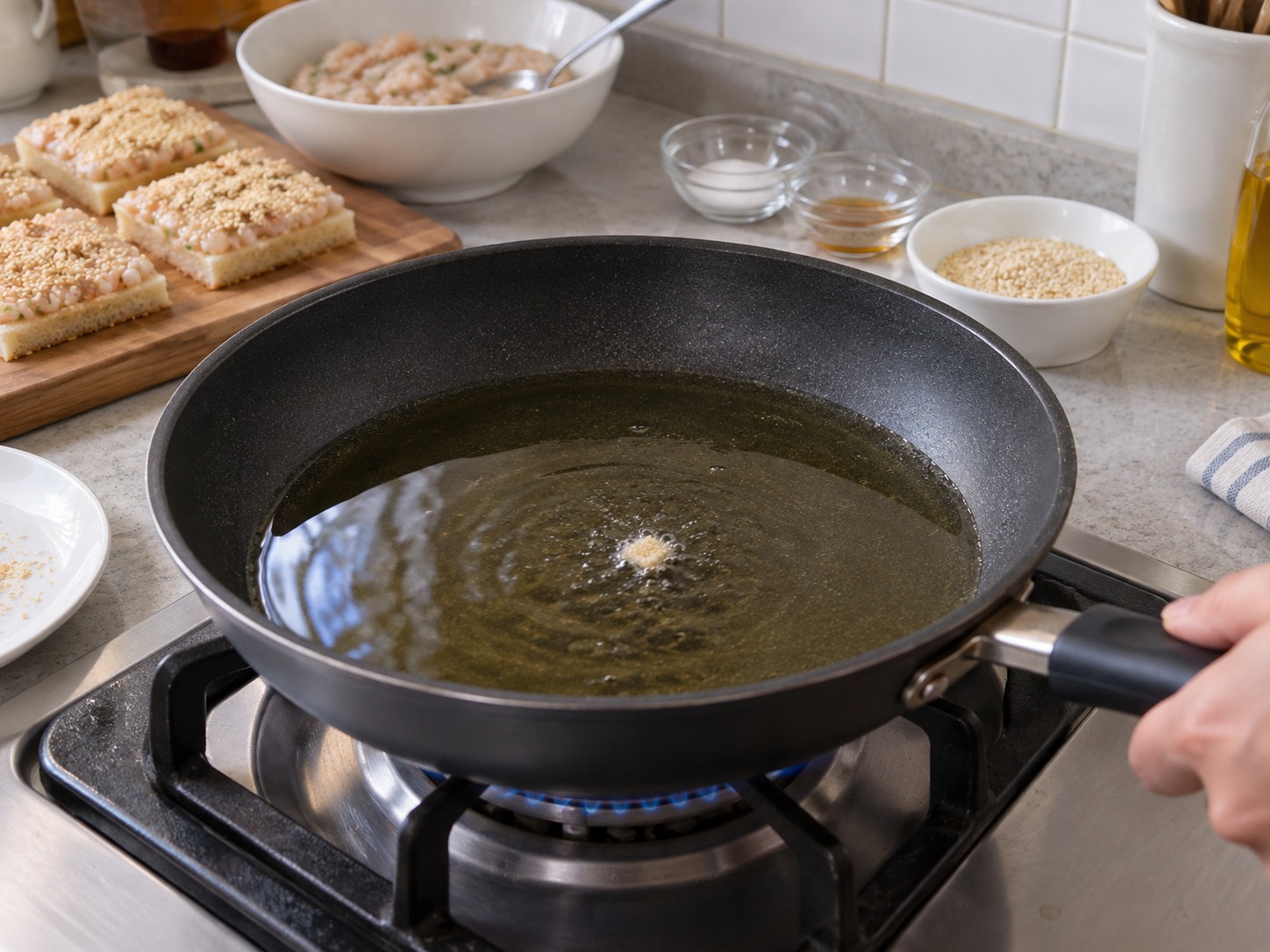 Hong Kong Sesame Prawn Toast — Heat oil over medium until a bread crumb sizzles gently