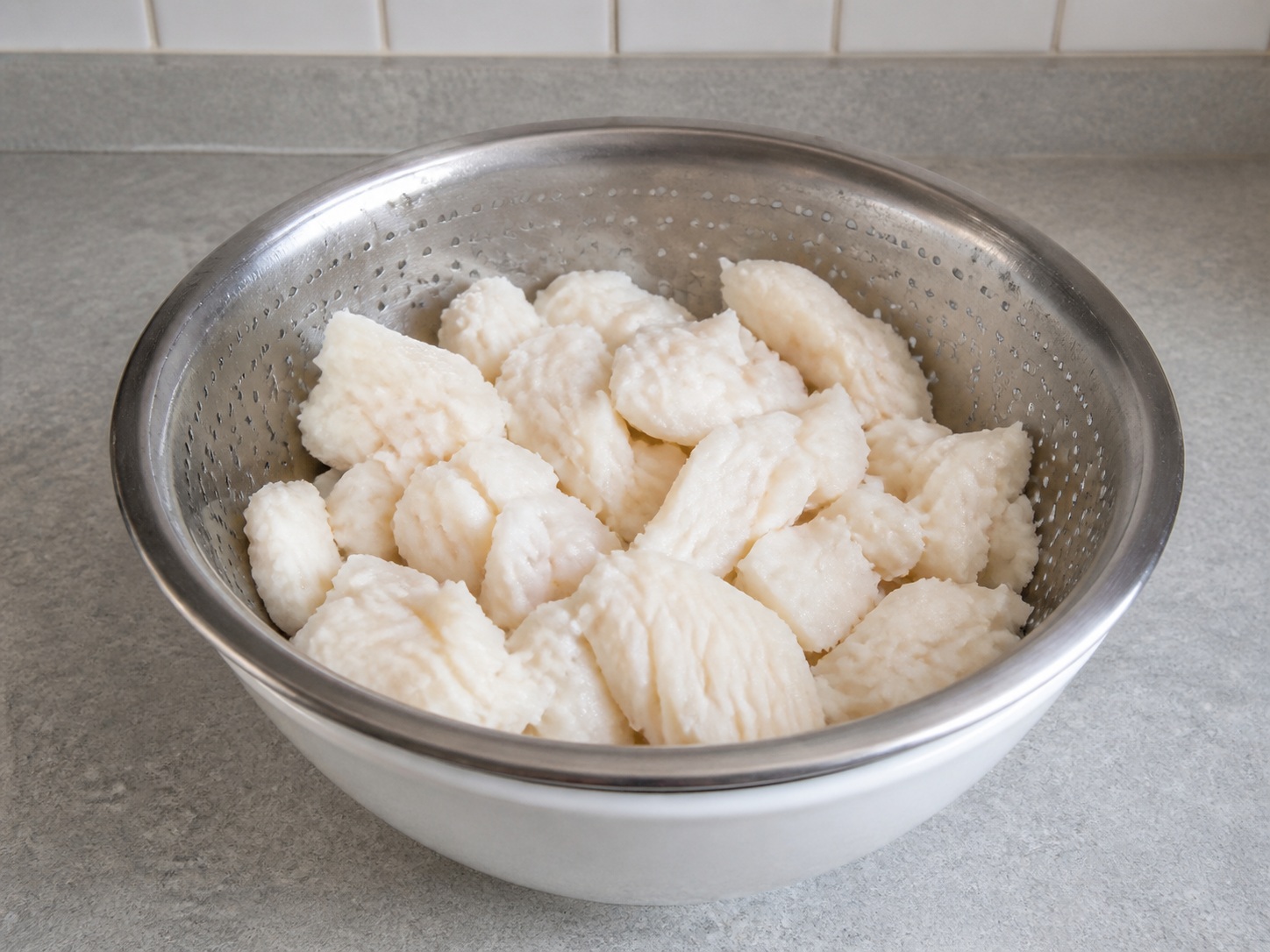 Drain and flake the fish: Drain and flake the fish. Use the listed ingredients and the appropriate household tool in order; confirm the food has reached the described state before continuing.