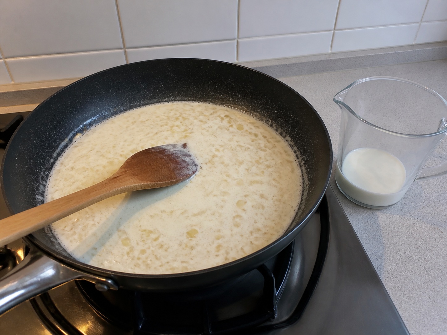 Whisk in milk: Whisk in milk. Use the listed ingredients and the appropriate household tool in order; confirm the food has reached the described state before continuing.