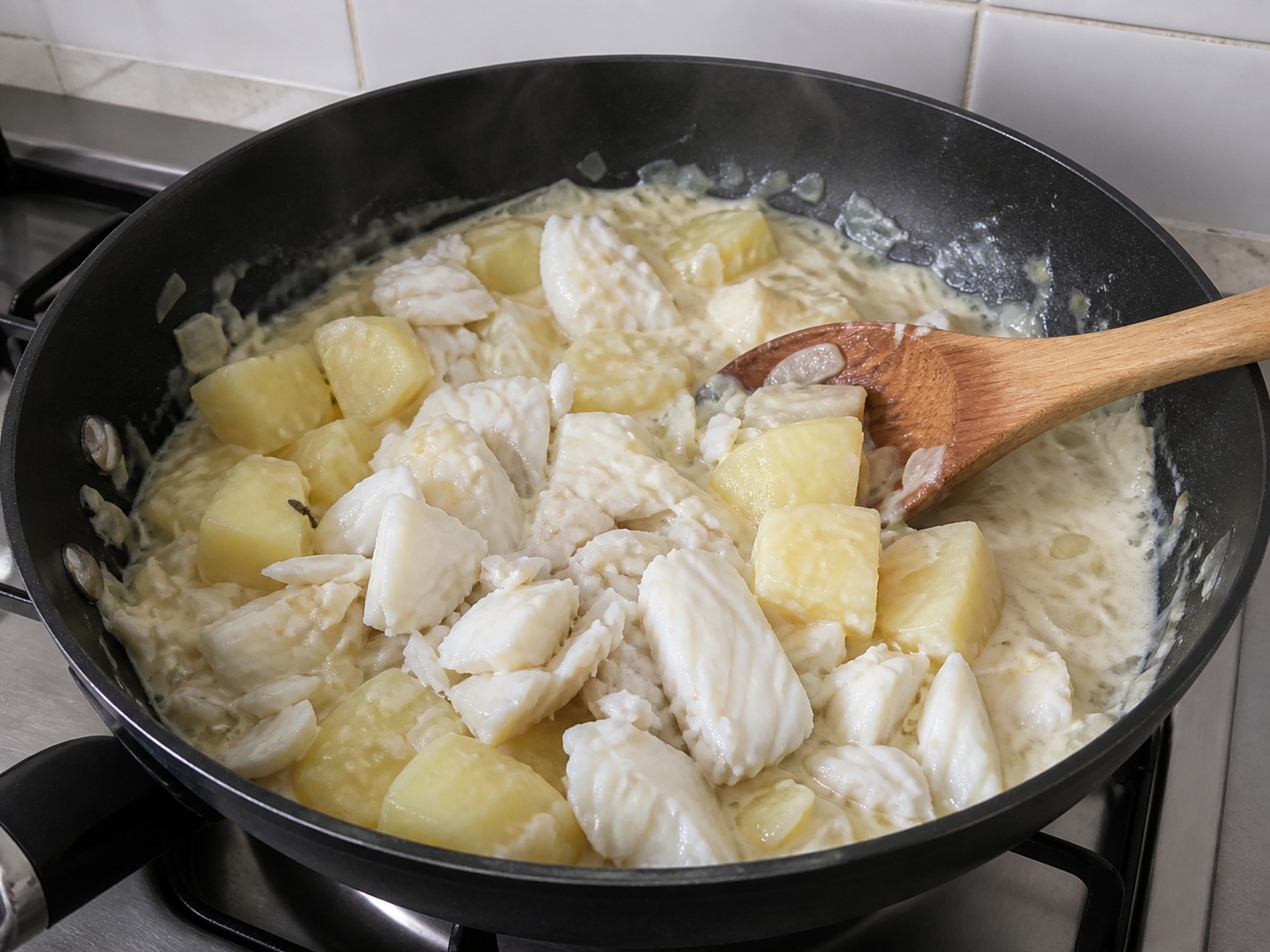 Fold in fish and potatoes: Fold in fish and potatoes. Use the listed ingredients and the appropriate household tool in order; confirm the food has reached the described state before continuing.