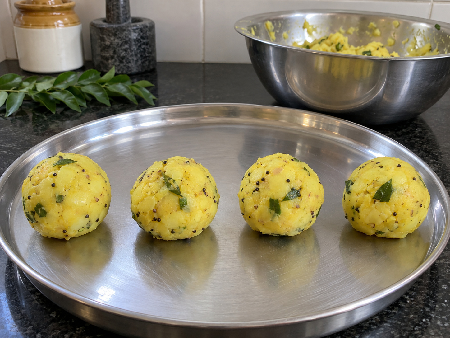 Indian Mumbai Vada Pav — Mix the spice oil and 1/2 tsp salt into potato