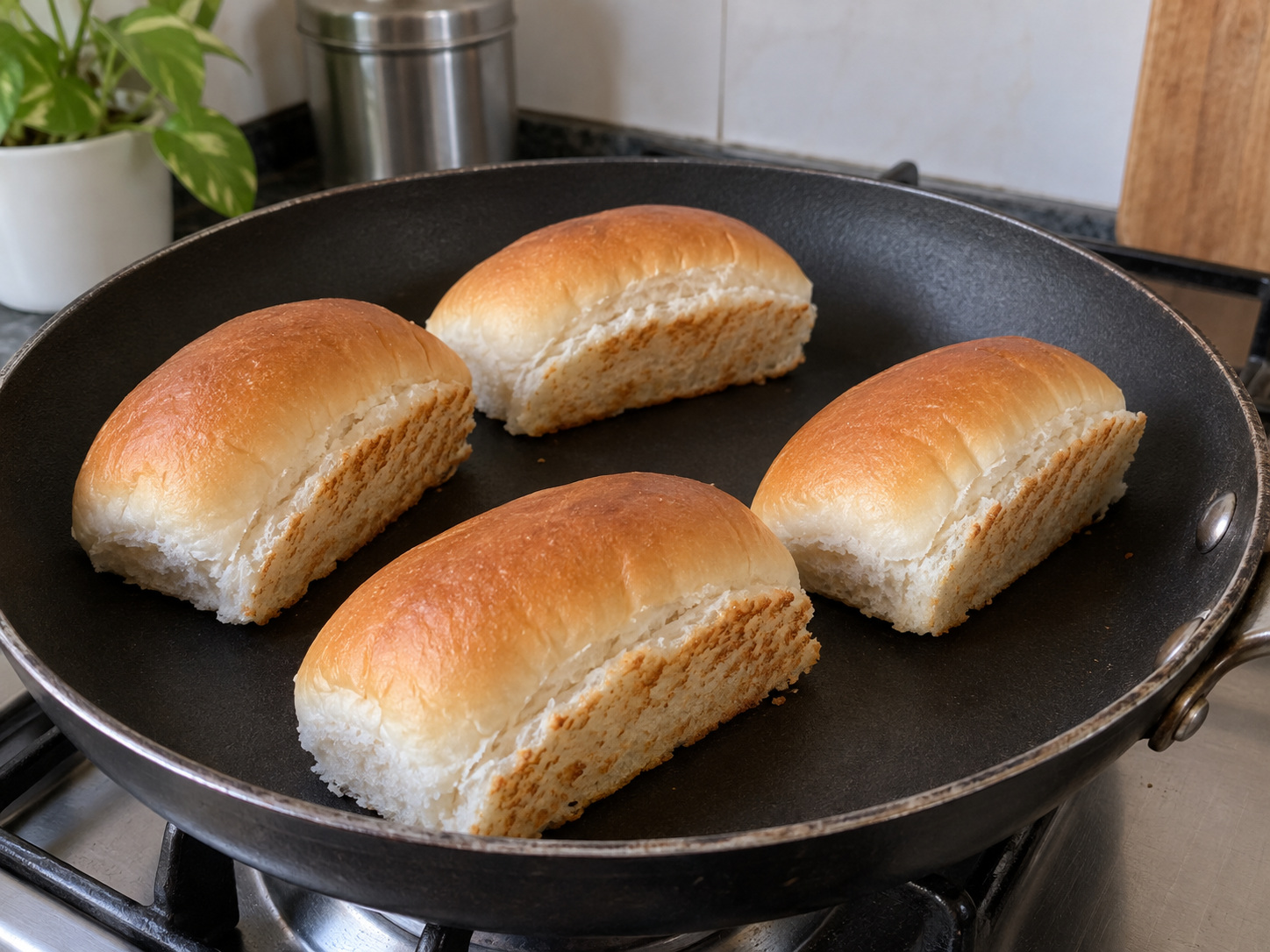 Indian Mumbai Vada Pav — Slit buns without cutting through and warm their cut sides briefly in a dry pan