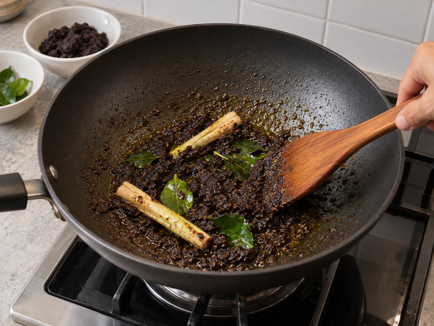 Indonesian Rawon Beef Soup — Fry the keluak bumbu until aromatic