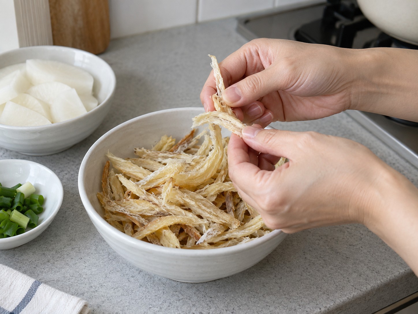 Korean Dried Pollock and Radish Soup — Inspect fish strips