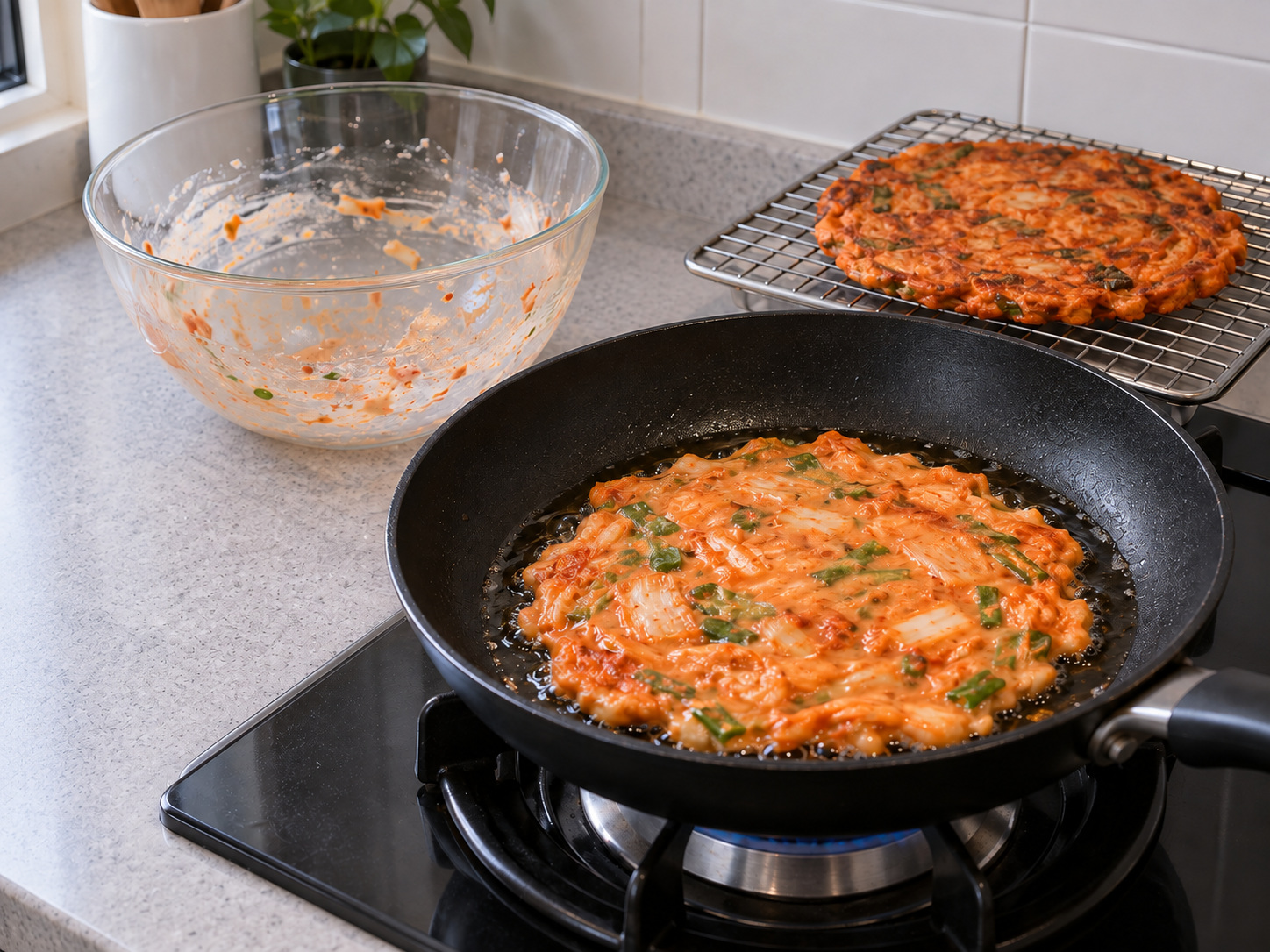 Korean Kimchi Jeon — Use remaining oil and batter to cook the second pancake