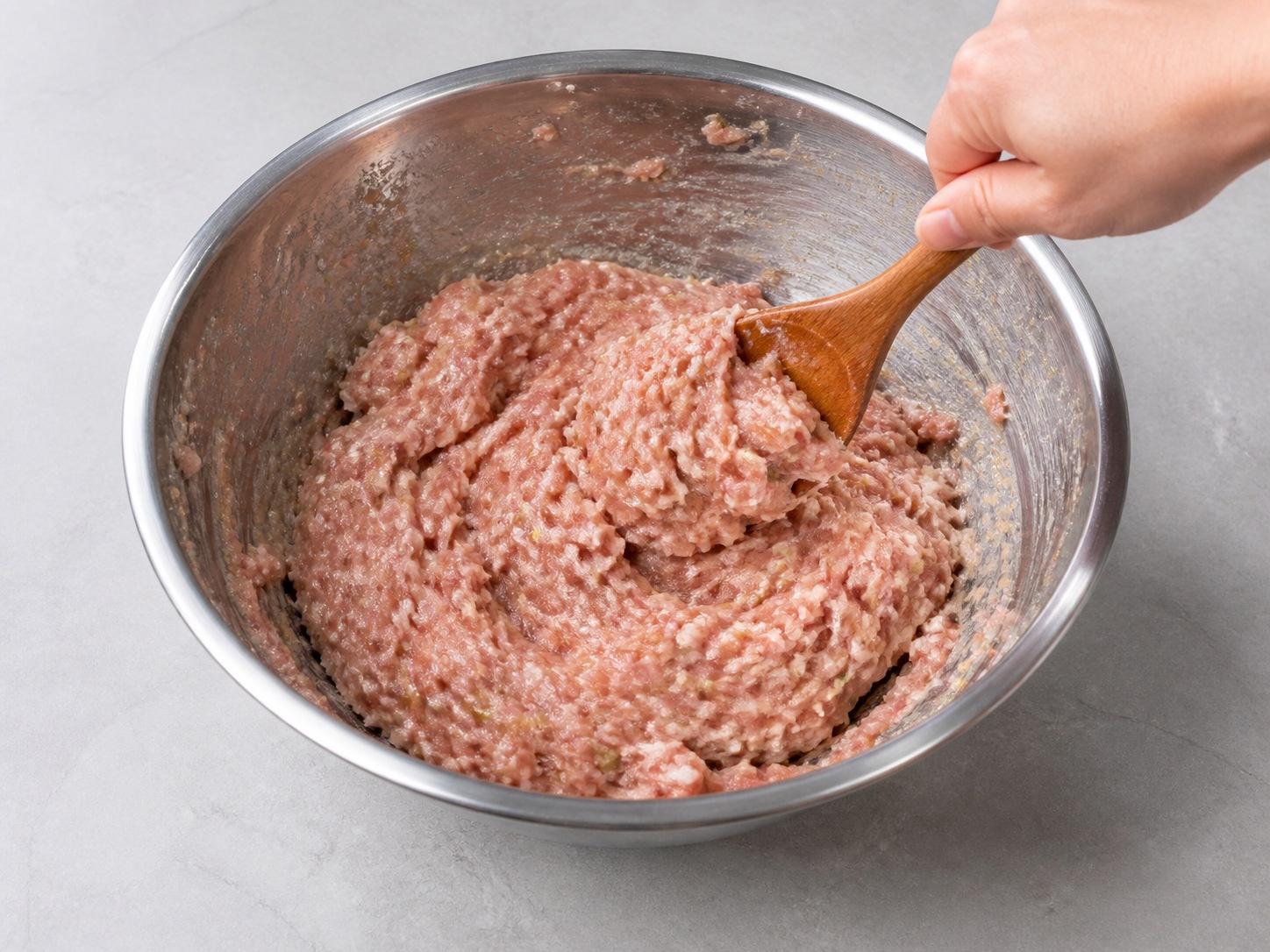 Shanghai Braised Lion's Head Pork Meatballs: Stir until tacky