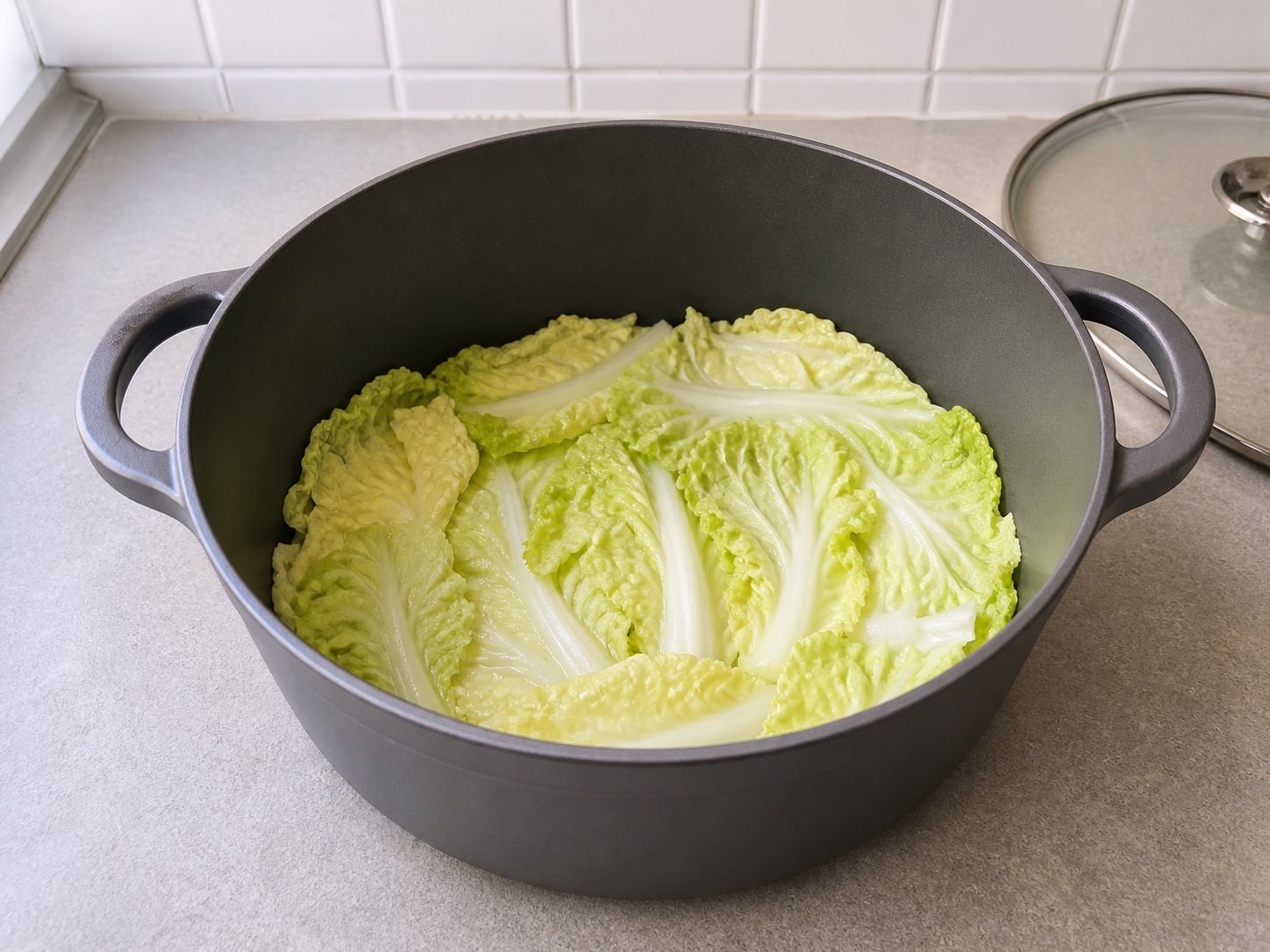 Shanghai Braised Lion's Head Pork Meatballs: Line the pot with cabbage