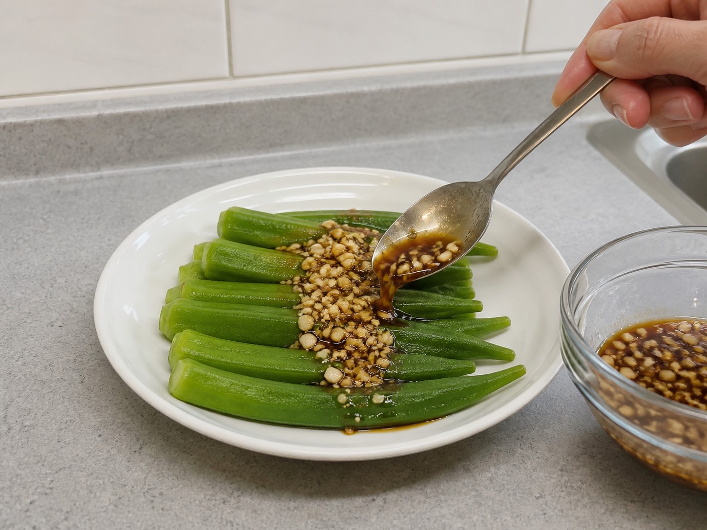 Steamed Okra with Garlic Soy Sauce — step 12: Sauce and serve
