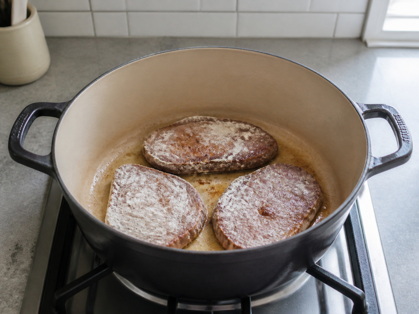 Swiss Steak with Tomato and Onions — Brown steaks