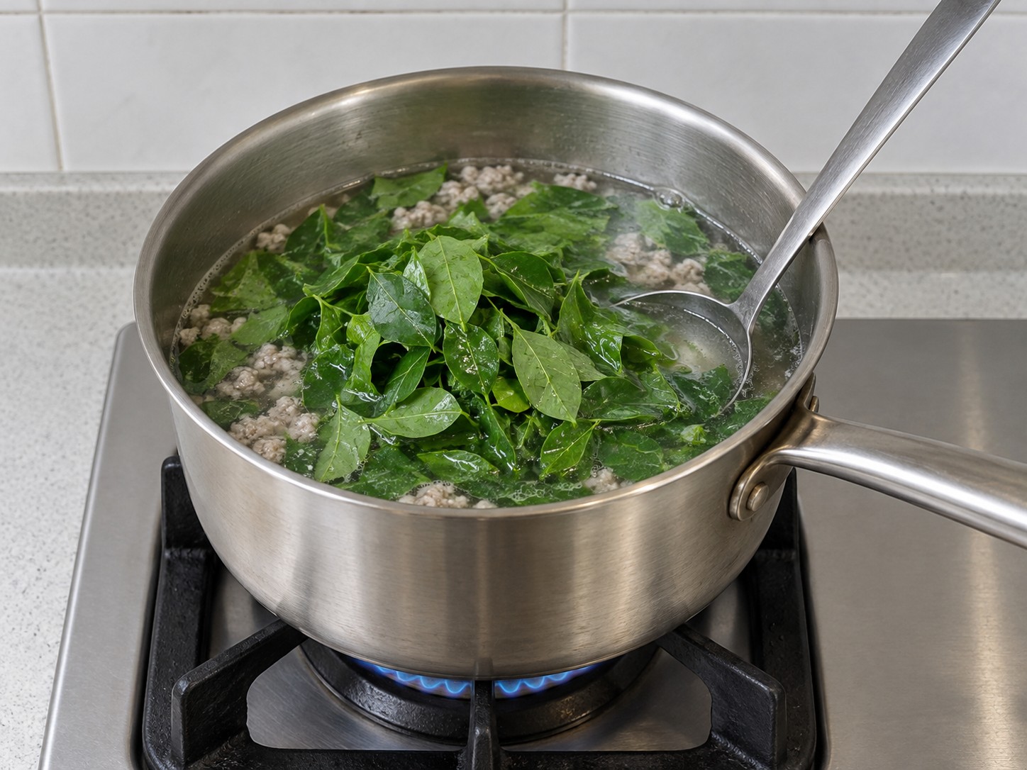 越式甜葉菜肉碎湯 — 10. 放入瀝乾的甜葉菜,輕壓至浸入湯中。