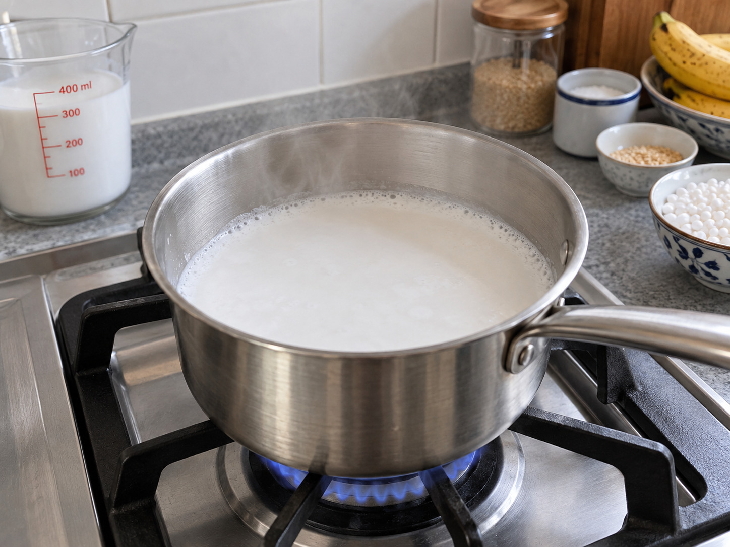 Vietnamese Che Chuoi Banana Coconut Dessert — Warm coconut milk gently in another pot